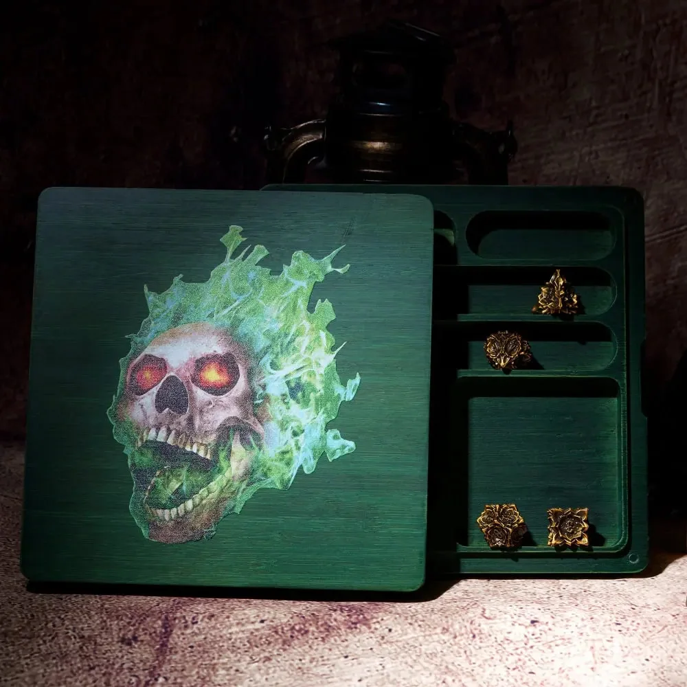 Green compartmented wooden dice box with a flaming skull design on the lid