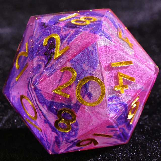 Close-up of a D20 with pink, purple and blue swirls, fine glitter and gold numbers.