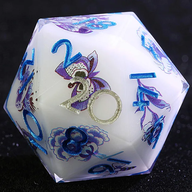Close-up of a white-core D20 with blue numbers and purple floral designs.