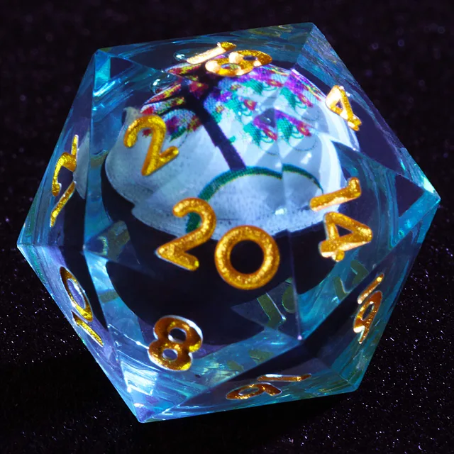 Close-up of a clear blue-tinted D20 with gold numbers and a flowering-tree inner core.