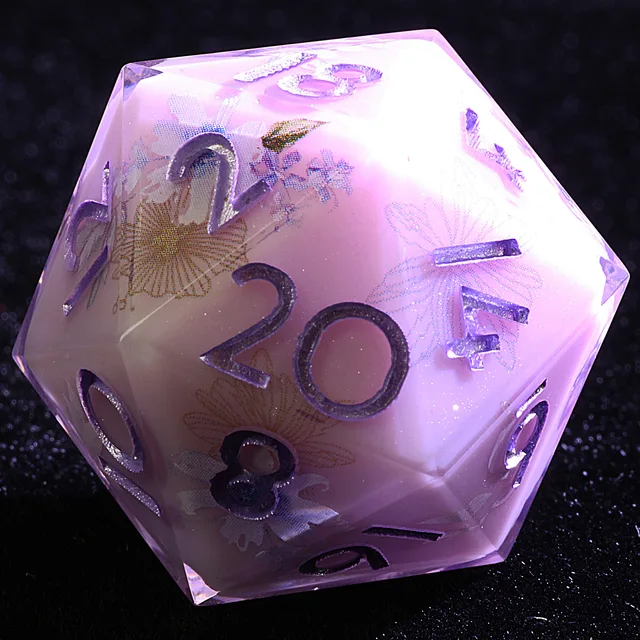 Close-up of a violet floral D20 with purple numbers and translucent edges.