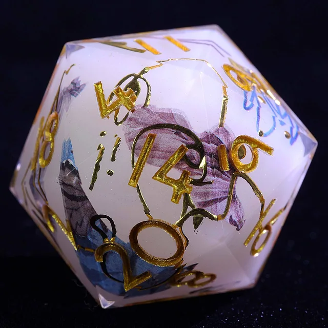 Close-up of a white-core D20 with gold numbers and blue and purple brushstroke-like markings.