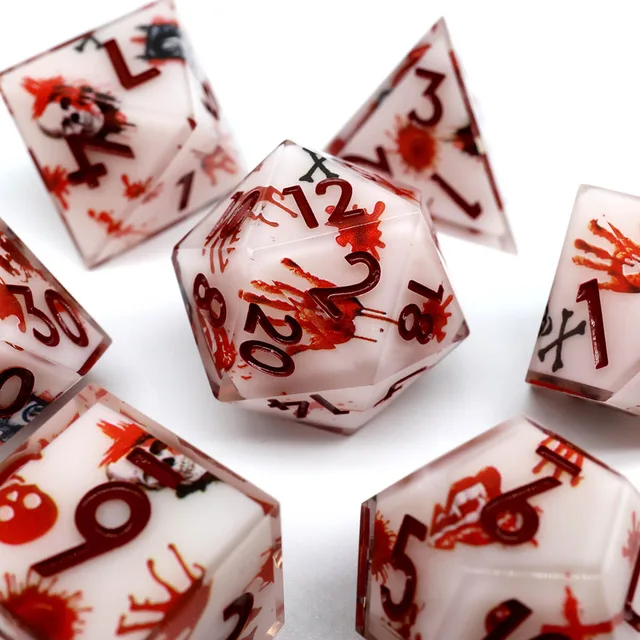 Close-up of a twenty-sided die with red handprints and dark red numbers.