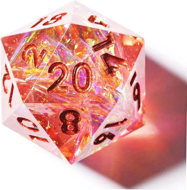 Close-up of a translucent pink D20 with iridescent flecks and copper-coloured numbers.