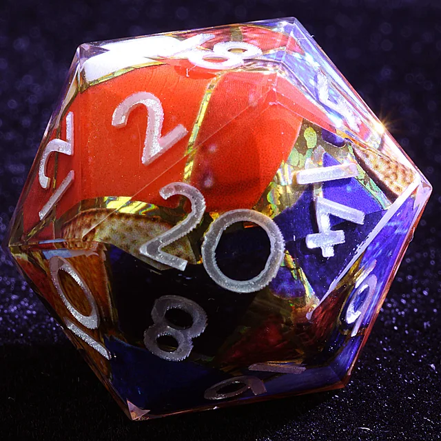 Close-up of a mosaic-patterned D20 with red and blue patches and pale numerals.