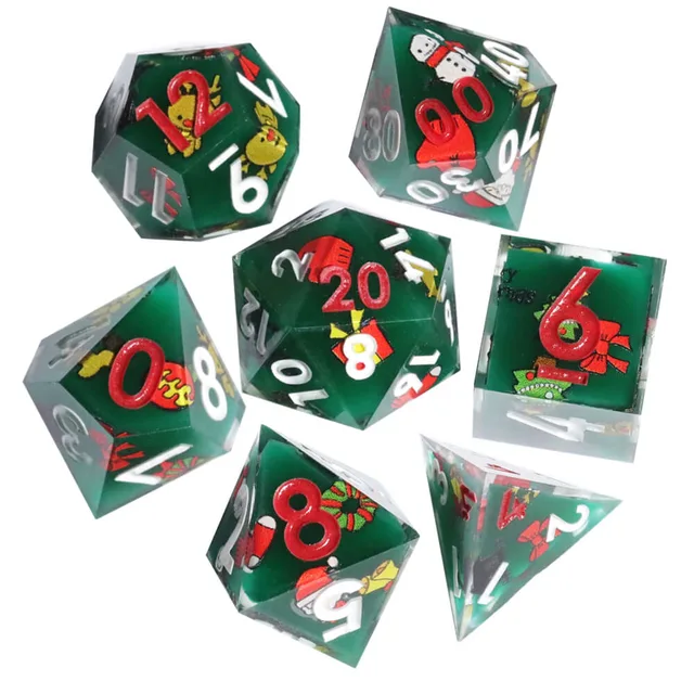 Seven green Christmas-themed polyhedral dice on white.