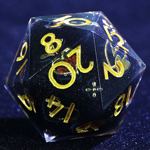 Close-up of a dark glittery D20 with gold numbers and a red-accented heart.