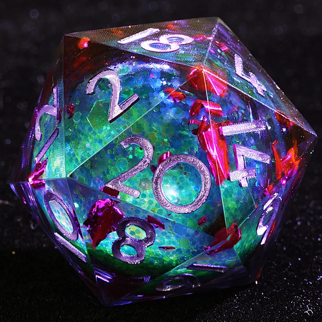 Close-up of a transparent D20 with a shimmering green-blue core, red-purple flecks, and silver numbers.