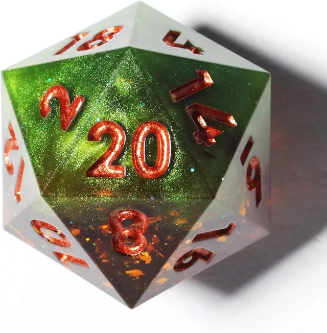 Close-up of a green and amber glitter D20 with copper-red numbers.