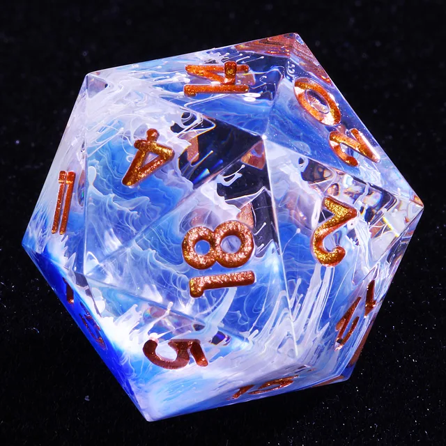 Close-up of a translucent blue and white swirled D20 with copper-gold numbers.