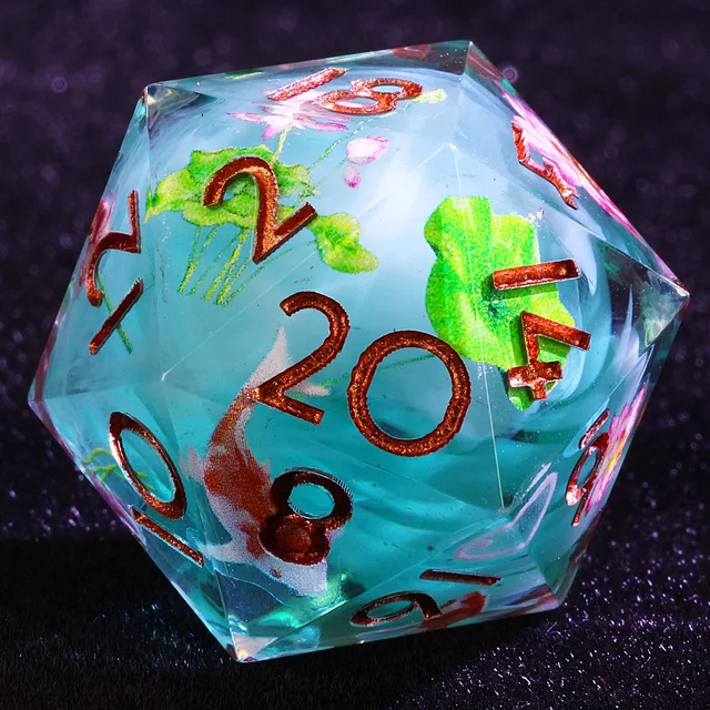 Close-up of an aqua-blue D20 with pink blossoms, green leaves and copper-coloured numbers.