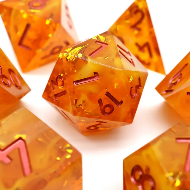 Orange D20 with yellow swirls, gold-toned flecks and red-pink numbers.