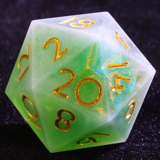 Close-up of a green and white swirled D20 with gold numbers.