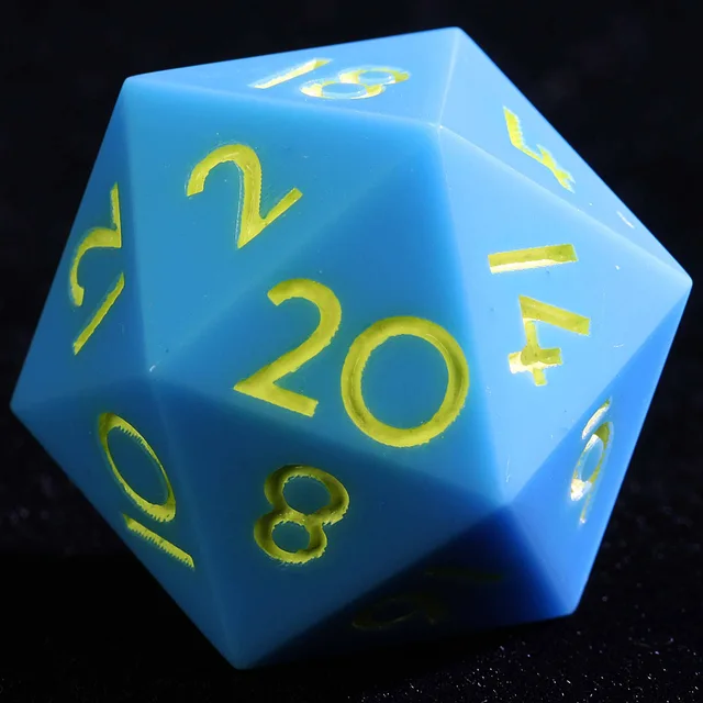 Close-up of a blue D20 with yellow-gold numerals.