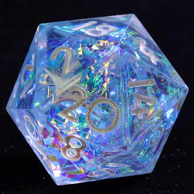 Close-up of a translucent blue D20 with iridescent flakes and silver-coloured numbers.