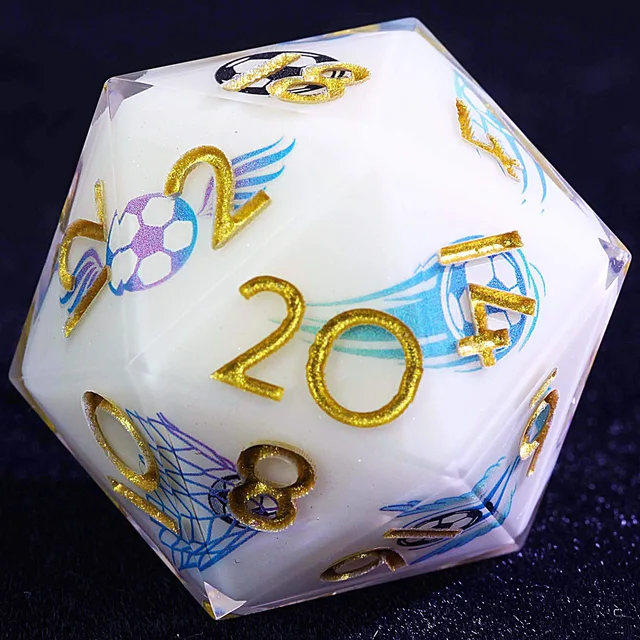 Close-up of a white D20 with gold numbers and blue football and goal-net graphics.