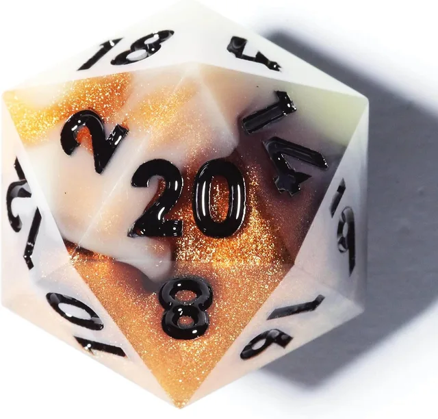 Close-up of an amber-orange glitter and white D20 with black numbers.