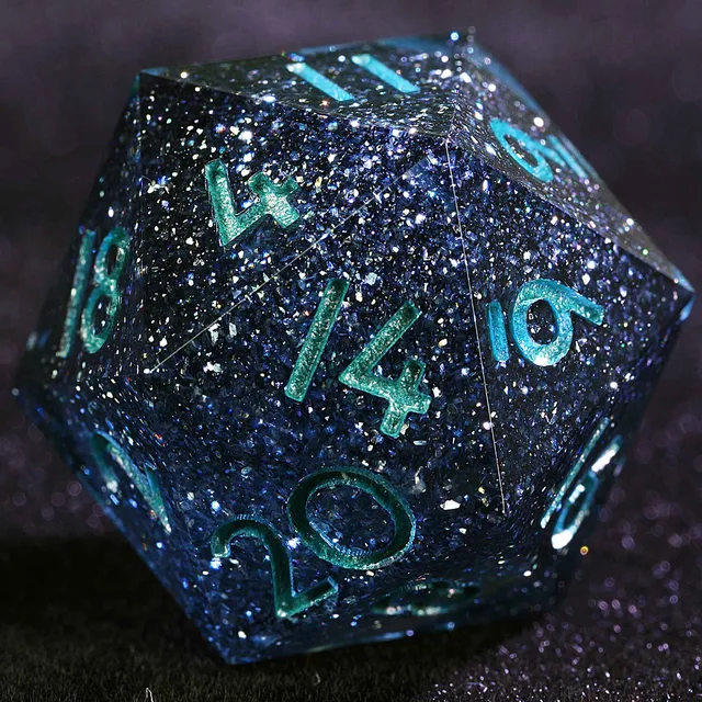 Close-up of a dark blue glitter D20 with turquoise-green numerals.