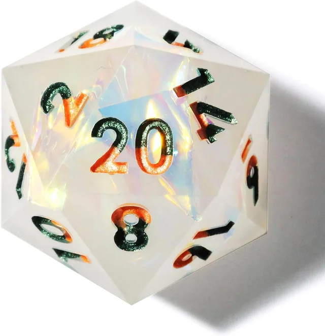 Close-up of a milky-white iridescent D20 with green and orange numerals.