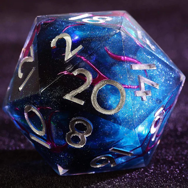 Close-up of a blue glitter D20 with magenta swirls and silver numbers.