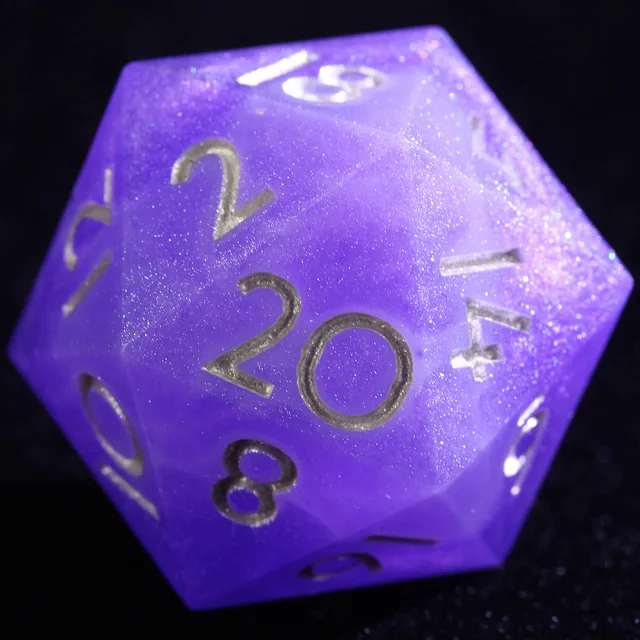 Close-up of a purple glittering D20 with silver-coloured numbers.