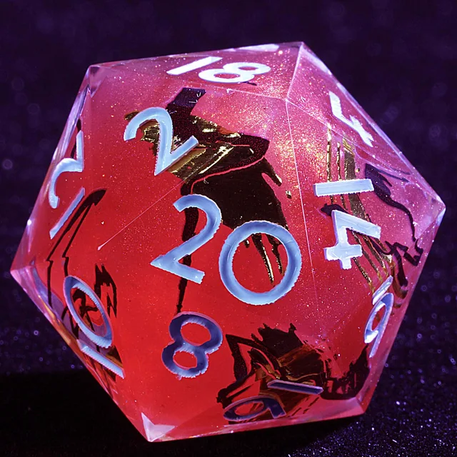 Close-up of a translucent pink-red D20 with glitter, black and gold accents, and pale numerals.