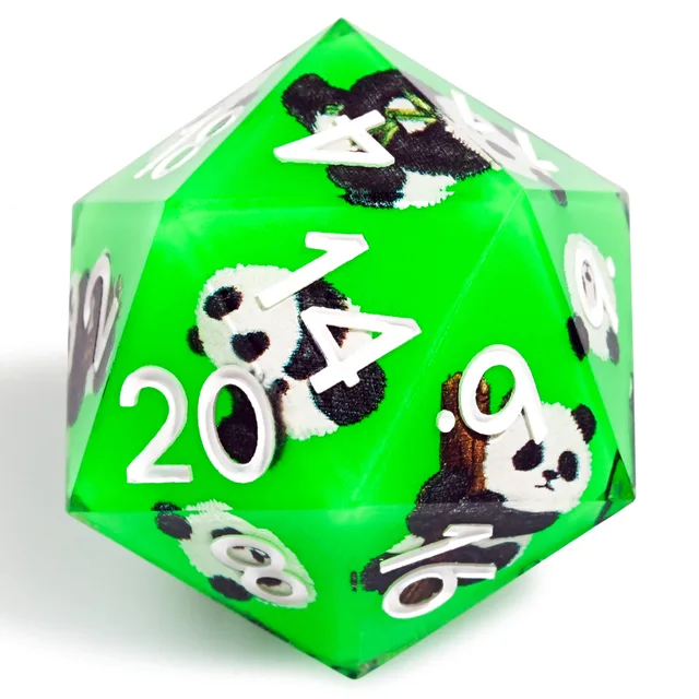 Close-up of a green D20 with white numerals and black-and-white panda illustrations.