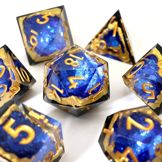 Blue crystalline-look D20 with gold numbers.