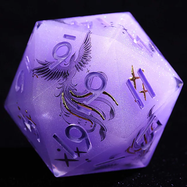 Close-up of a lavender-purple polyhedral die with a black phoenix illustration, pale numerals, and gold accents.