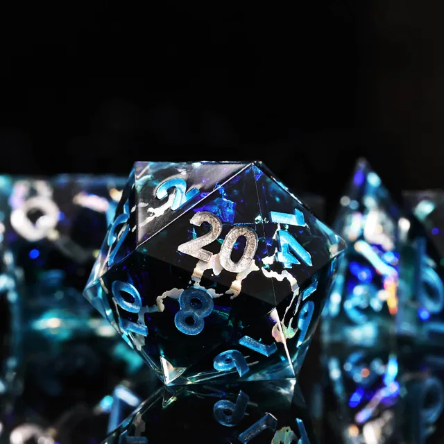 Close-up of a dark blue D20 with a silver 20 and pale lightning-like streaks.