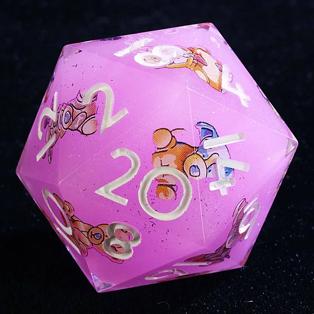 Close-up of a lilac-pink D20 with white numerals, glitter and cartoon animal illustrations.