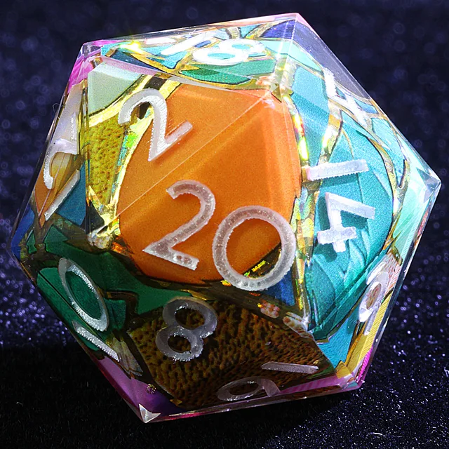 Close-up of a clear D20 with orange, blue and green angular inclusions and pale numbers.