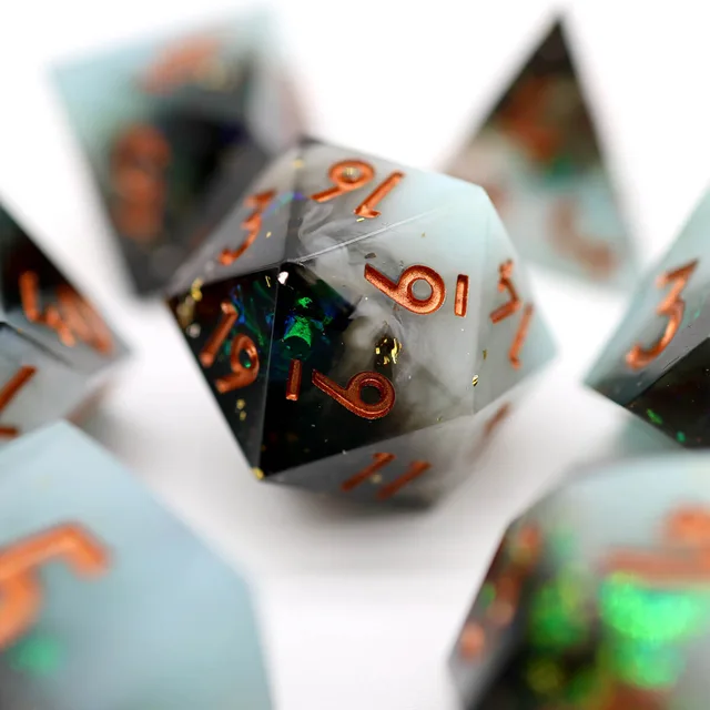 Close-up of a matching multifaceted die with copper numbers.