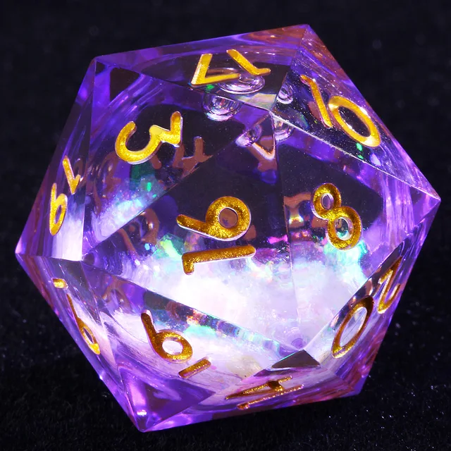 Close-up of a purple transparent D20 with gold numbers and a white, iridescent-filled core.