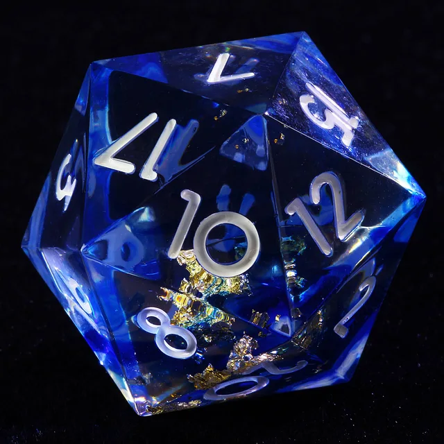 Close-up of a blue transparent D20 with gold flakes and white numbers.