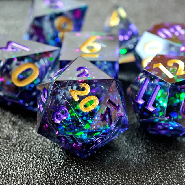 Close-up of the purple glitter-filled D20 with gold 20 and purple numerals.