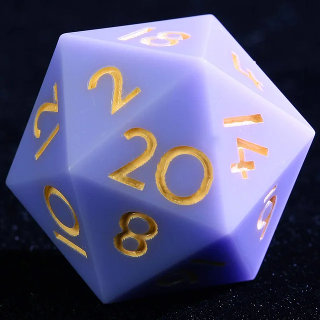 Close-up of a pale lavender D20 with gold numbers.