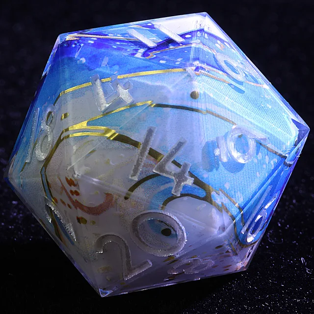 Close-up of a blue and white twenty-sided die with gold-toned lines and pale numerals.