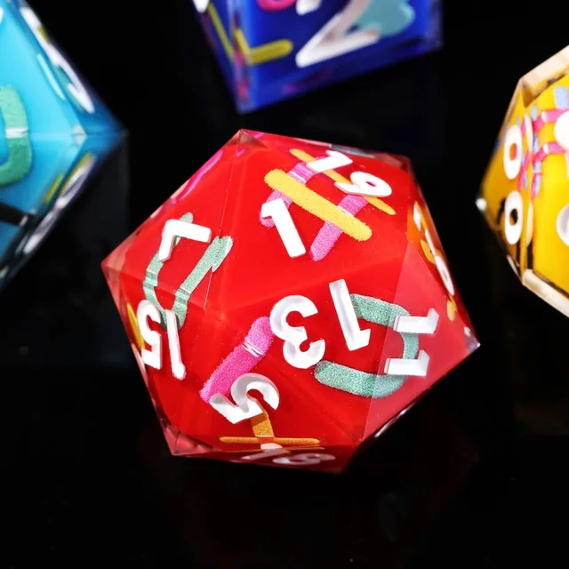 Close-up of the red D20 with white numerals and colourful interior marks