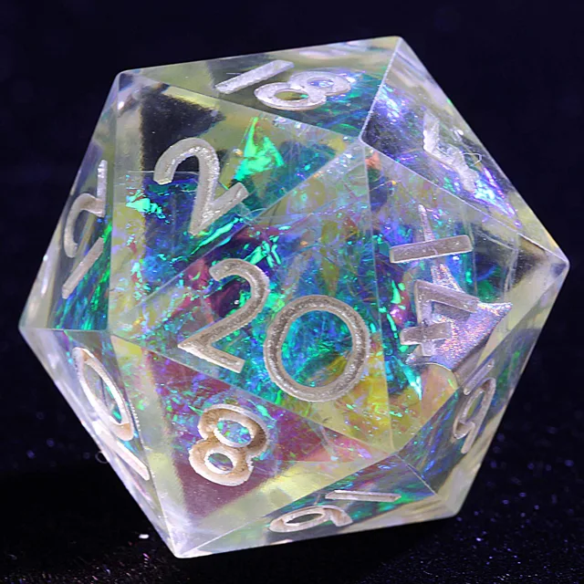 Close-up of a clear D20 with iridescent blue-green inclusions and pale numerals.
