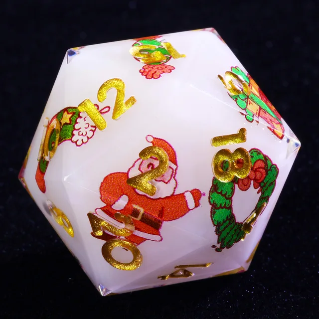 Close-up of a white D20 with gold numbers, Santa and wreath illustrations, and clear edges.