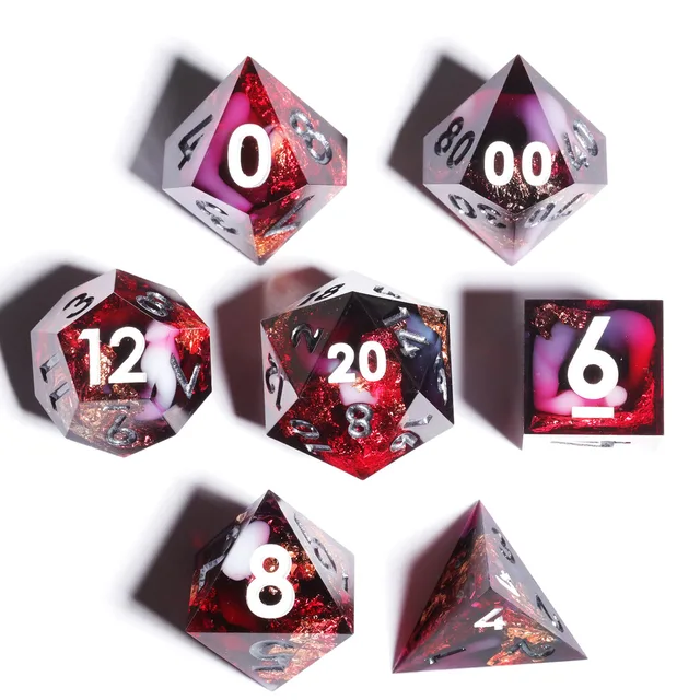 Seven red and black sharp-edged dice with pink swirls arranged on white.