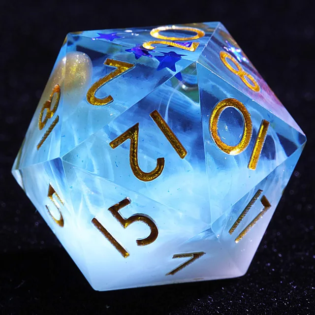 Close-up of a blue and white swirled D20 with gold numbers and blue stars.