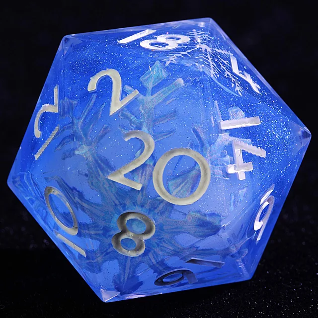 Close-up of a translucent blue D20 with white numbers, fine sparkle and frosty branching patterns.