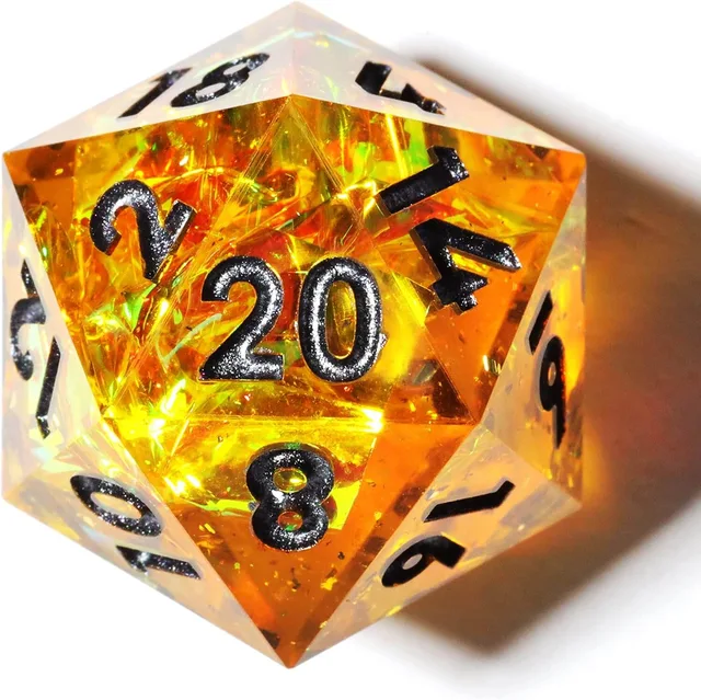 Close-up of a golden-amber D20 with reflective inclusions and dark numerals.