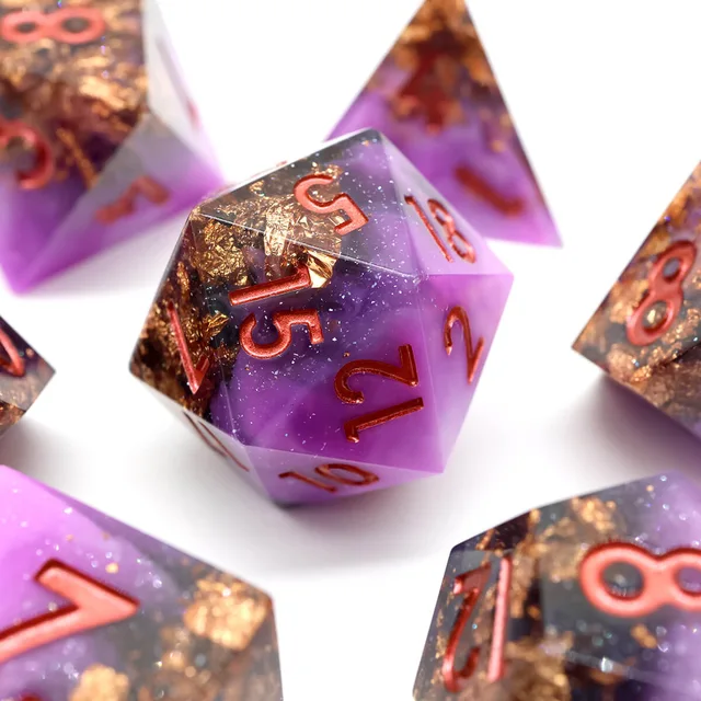 Sharp-edged purple D20 with gold-coloured flakes and copper-coloured numbers.
