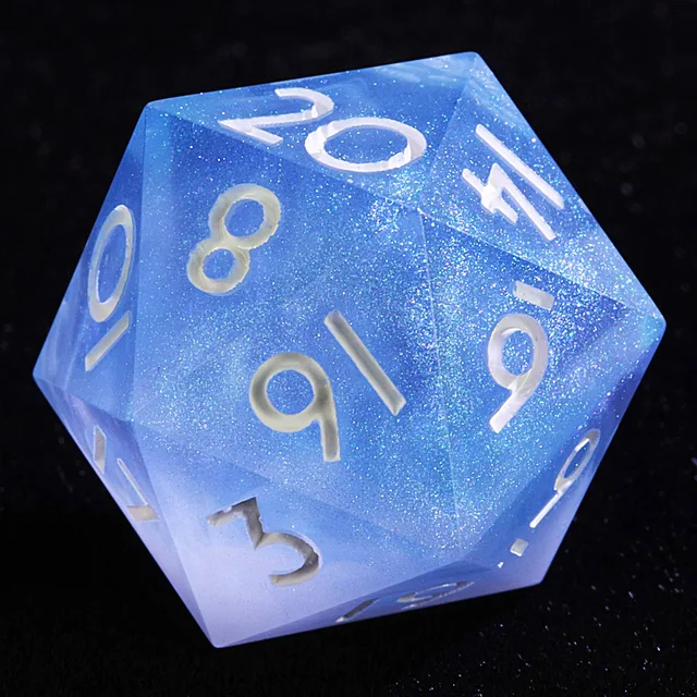 Close-up of a blue-to-white glittering twenty-sided die with pale numerals.