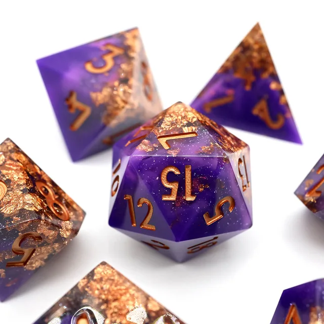 Purple D20 with gold-coloured numerals and gold-coloured flakes.