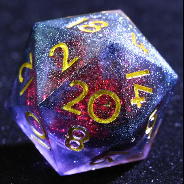 Close-up of the D20 showing gold numbers over a crimson centre and purple-blue glitter.