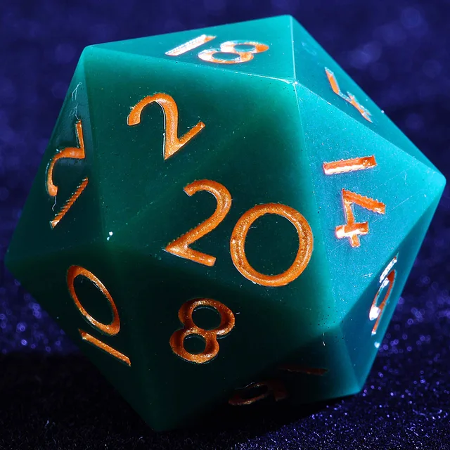 Close-up of a deep green-teal D20 with copper-orange numbers.